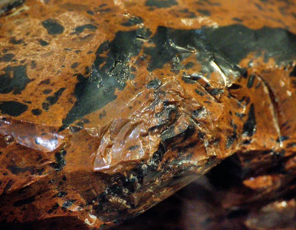Close-up of a rough, brown and black rock surface